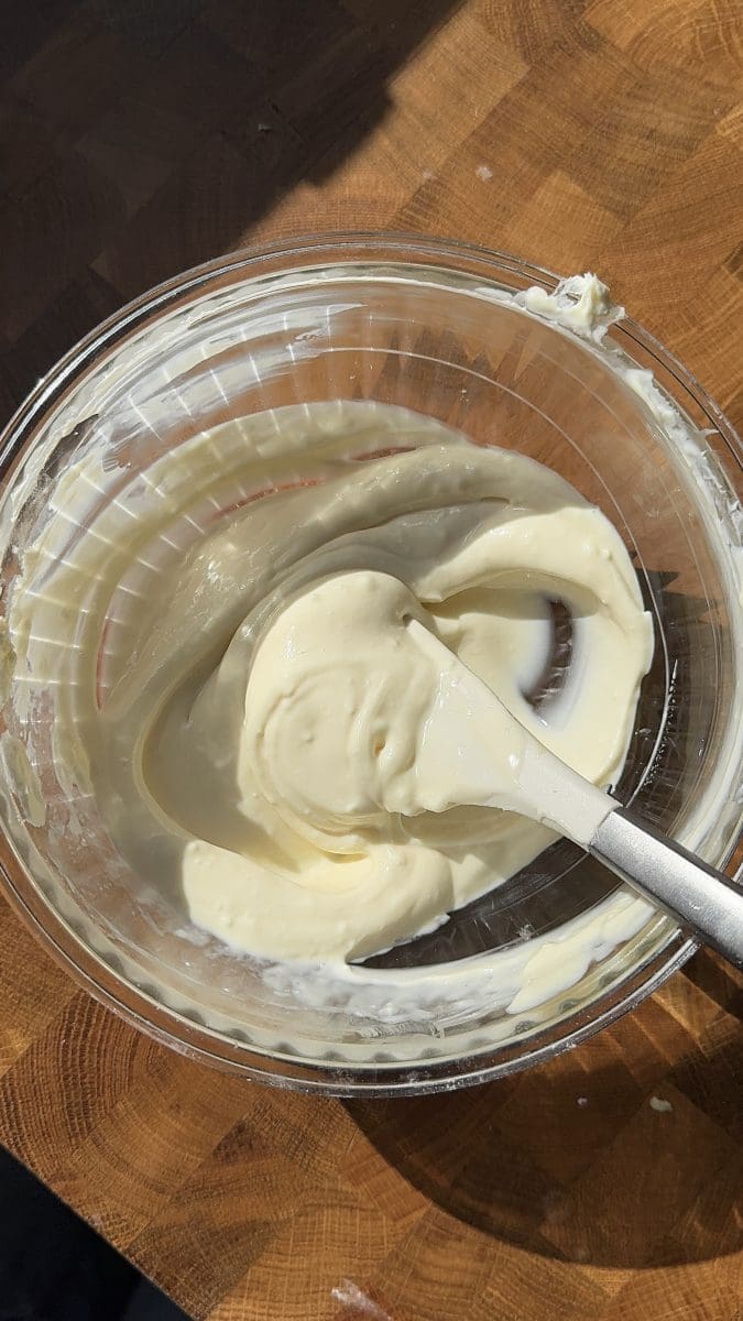 Cheesecake filling in a mixing bowl.