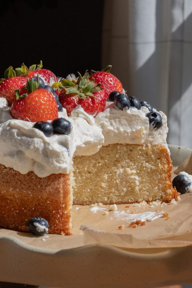 Close up cross section of the berries and cream cake.