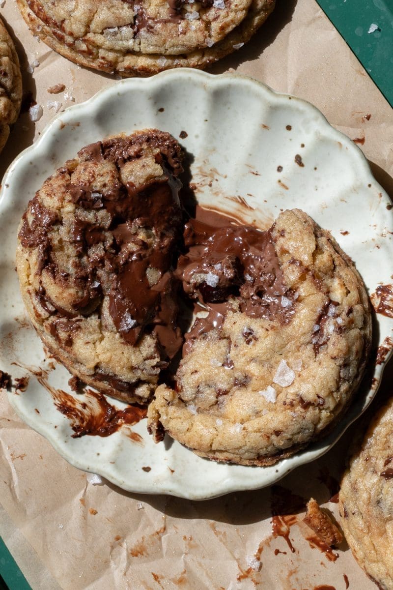 Close up of one of the nutella stuffed chocolate chip cookies broken in half.