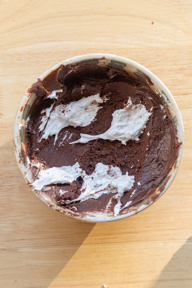 Dollops of marshmallow over the cookie dough.