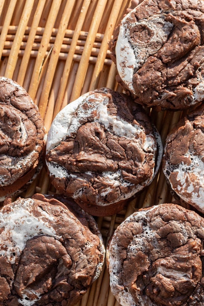 Close up of the hot chocolate brownie cookie sandwiches on a tray.