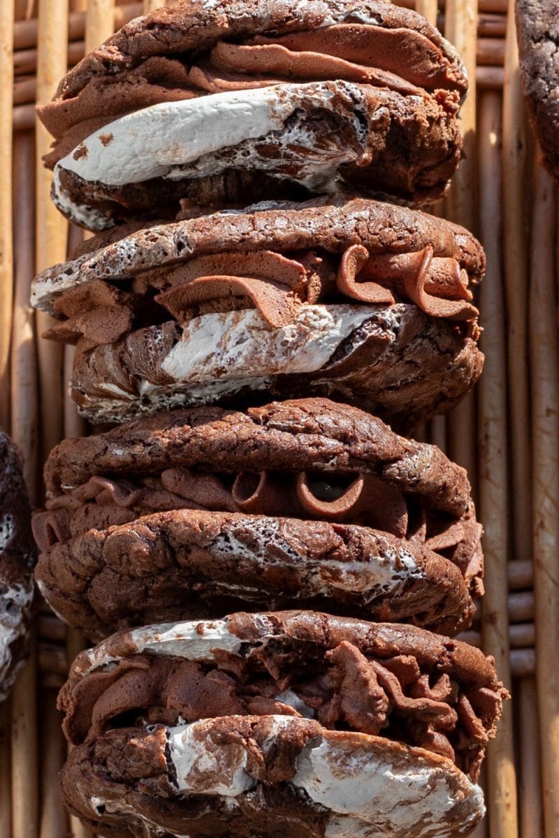 Side view of the hot chocolate brownie cookie sandwiches, filled.