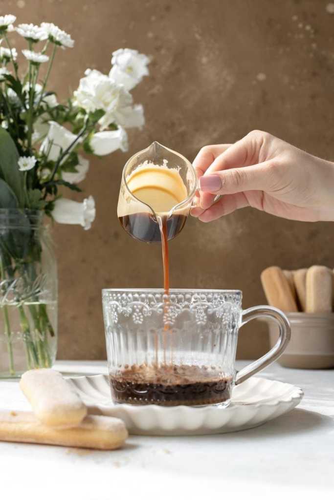 Pouring the espresso over the cocoa and sugar.