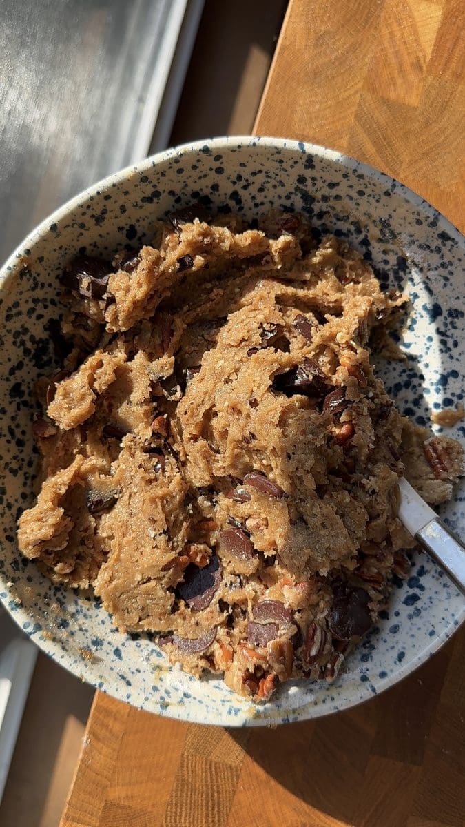 The finished cookie dough in a mixing bowl.