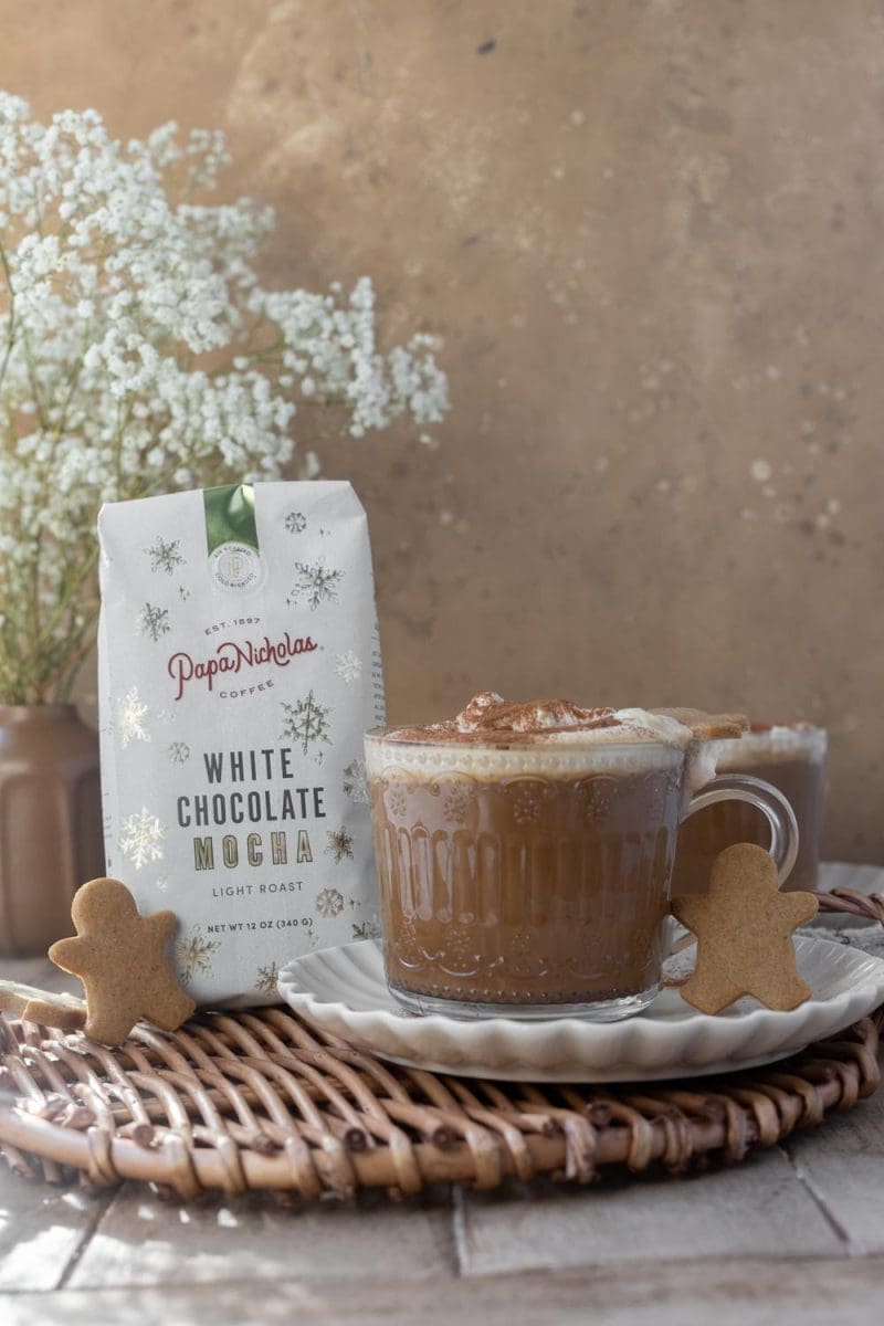 A picture of the gingerbread white mocha next to a bag of coffee