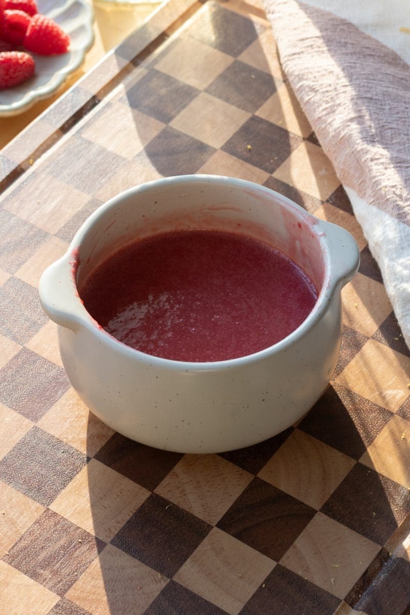 Raspberry curd in a small bowl.
