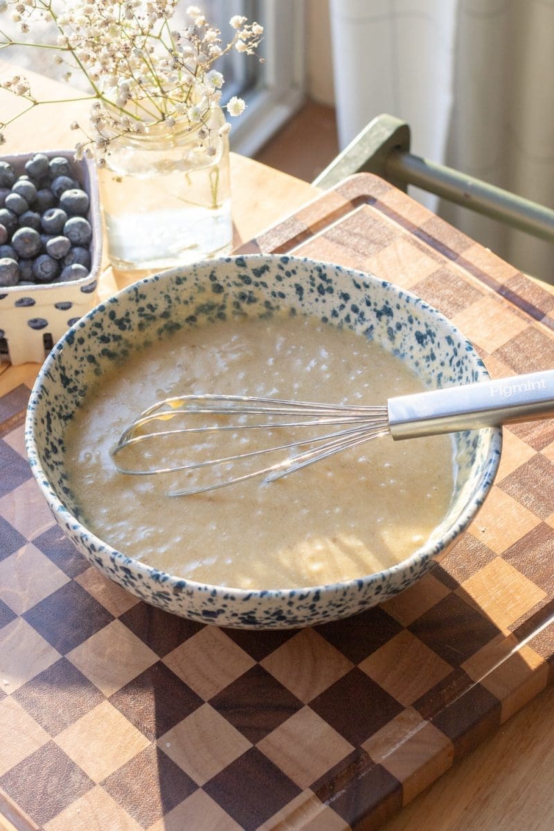 The wet ingredients of the cake whisked together.