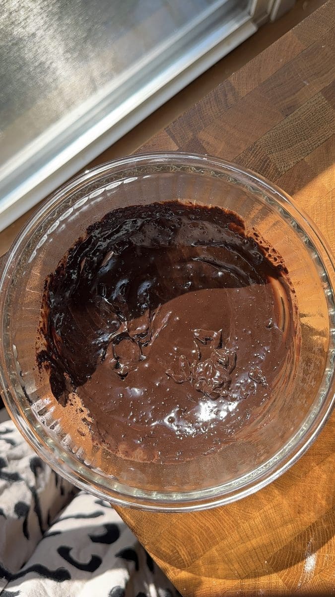 The cocoa and milk mixed together.