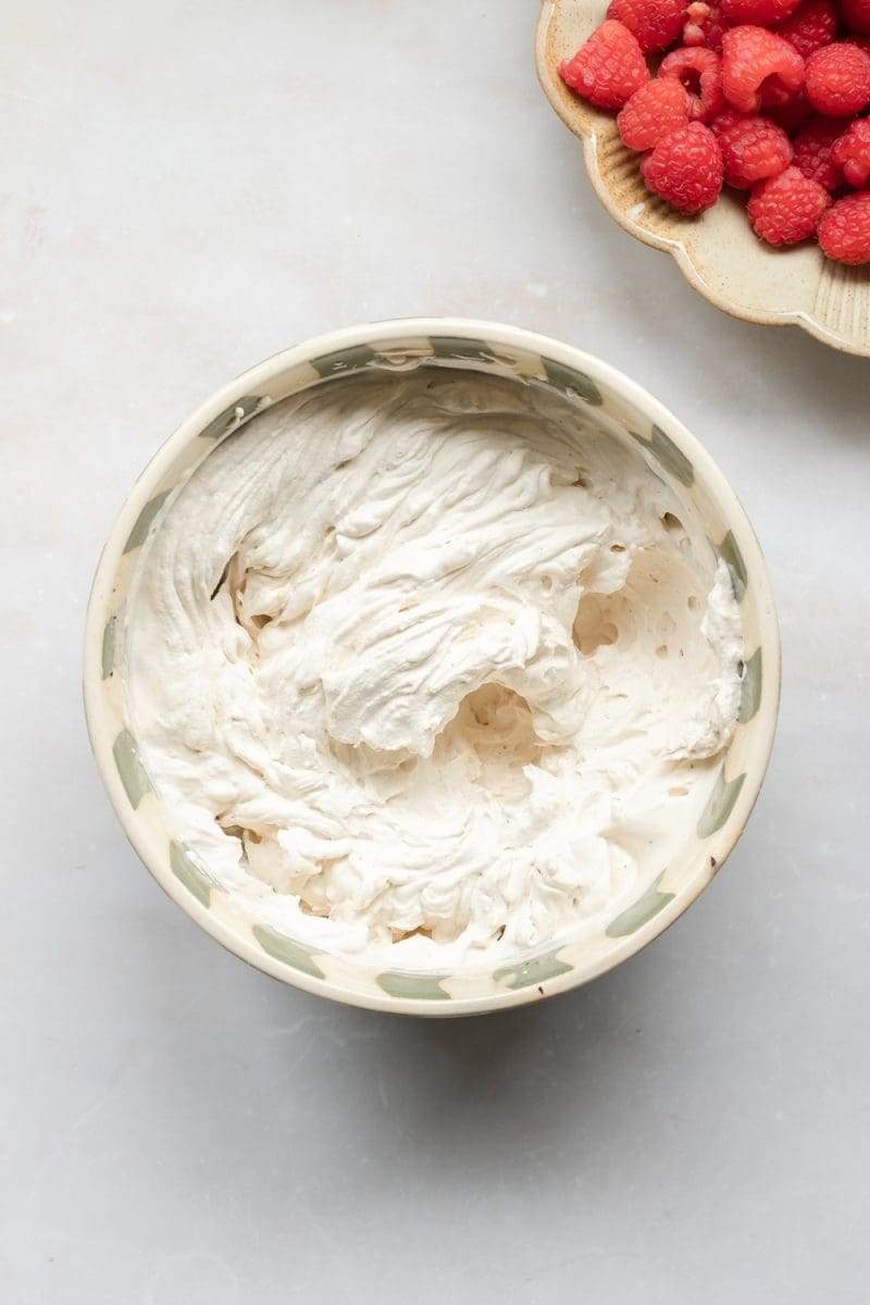 Whipped up espresso whipped cream in a mixing bowl.