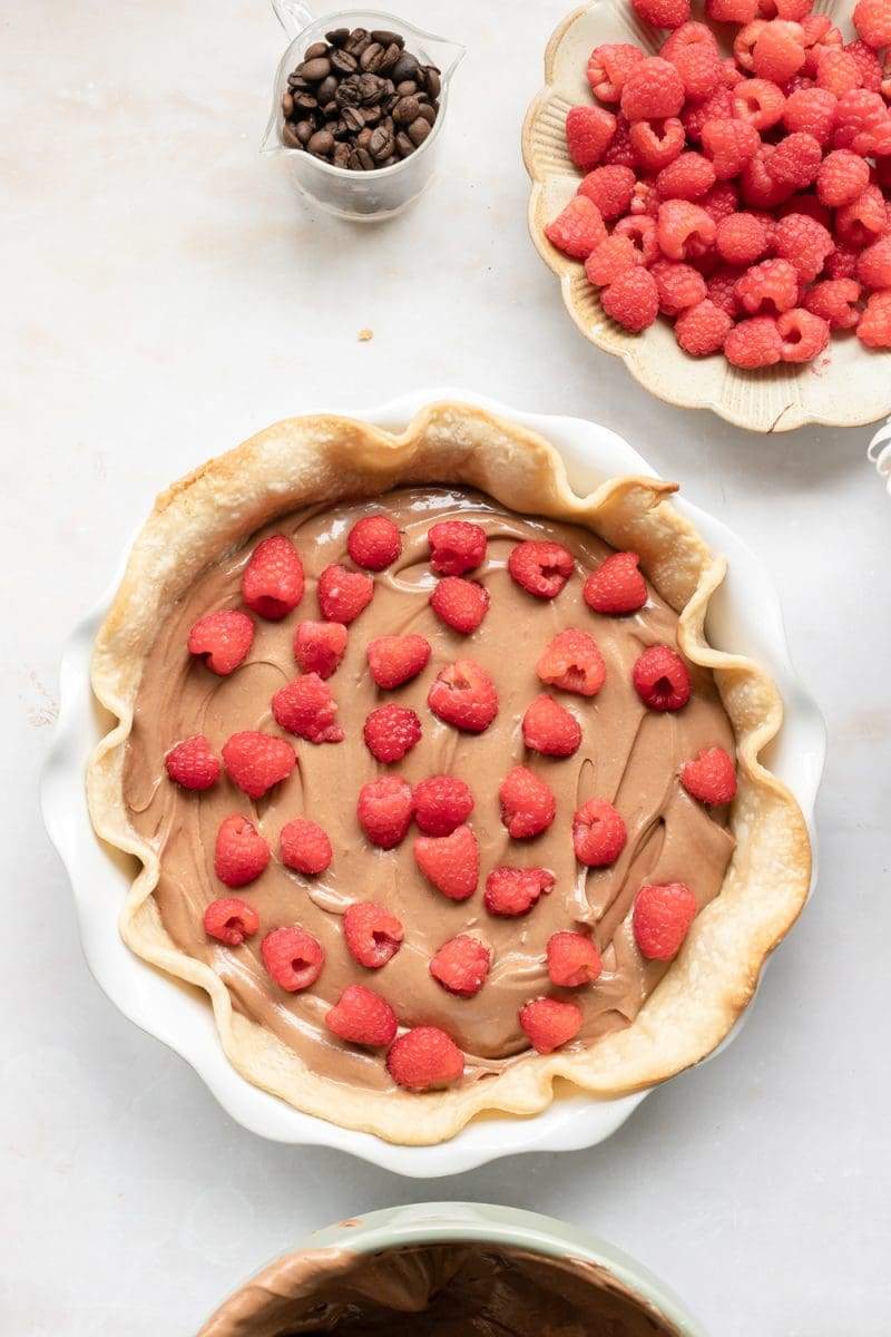 Layering raspberries into the french silk pie.