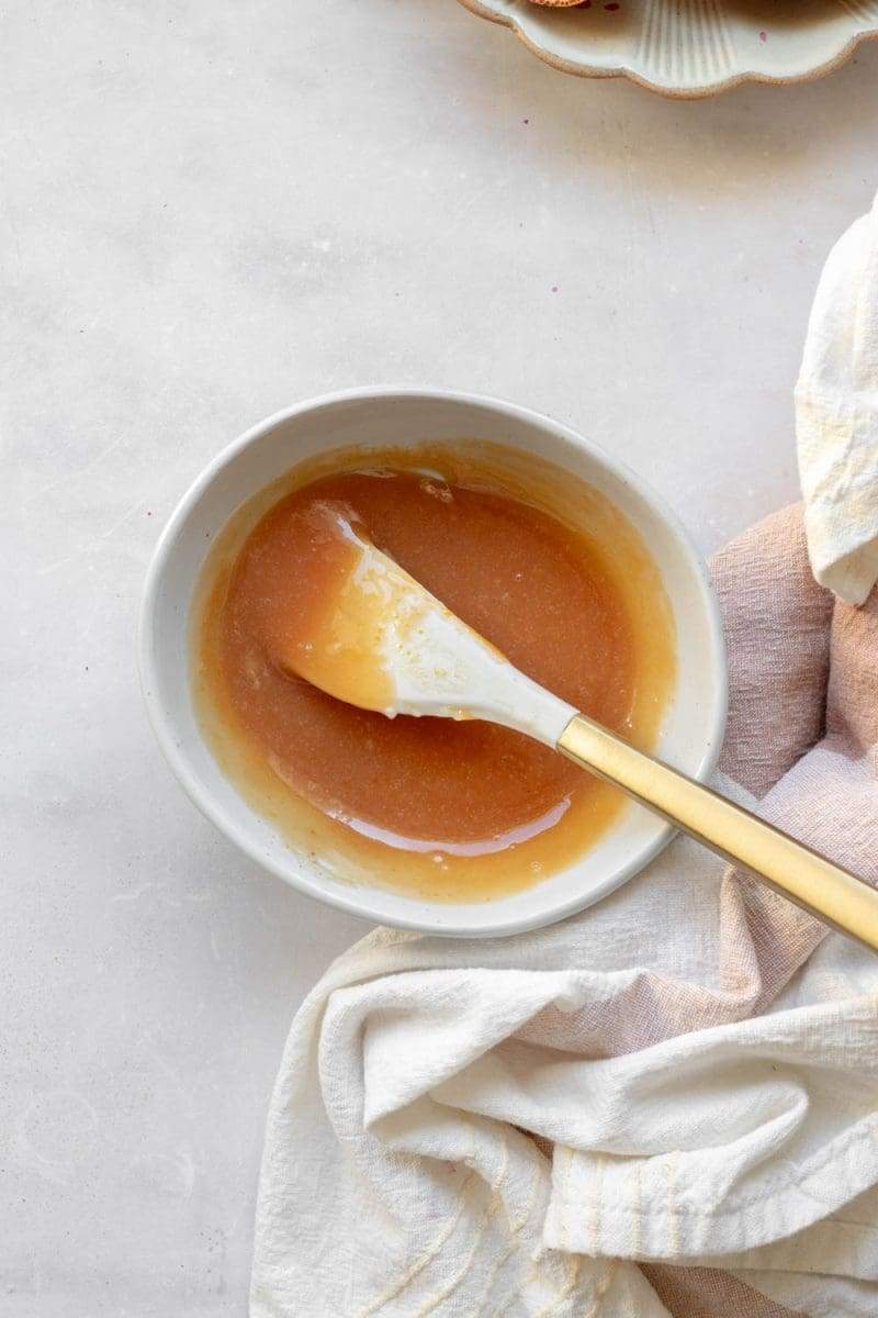 the blood orange curd in a small mixing bowl after cooking