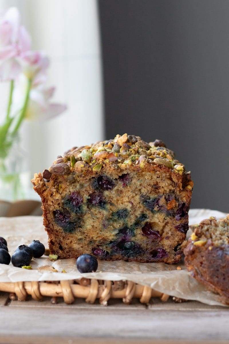 A straight-on view of the cross-section of the blueberry banana bread.