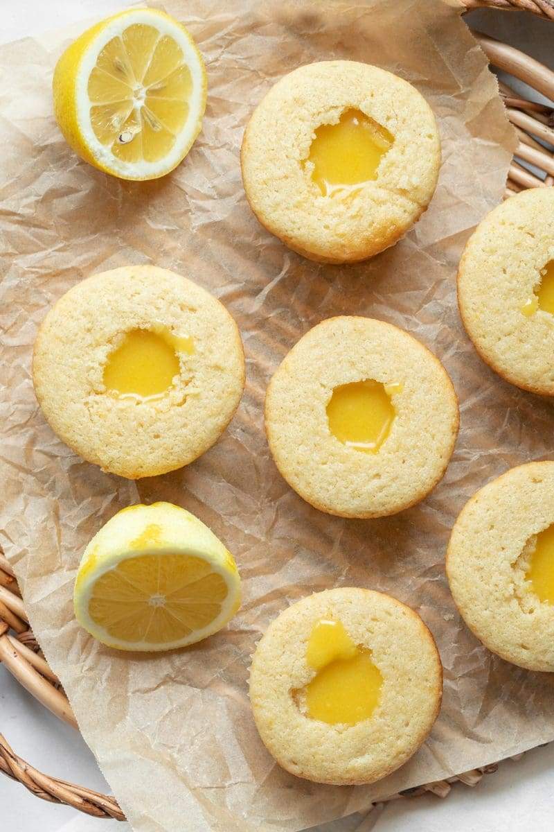 the cupcakes with a hole cut out of the center, filled with the lemon curd