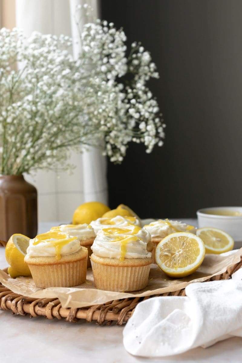 picture of the lemon curd cupcakes with flowers in the background