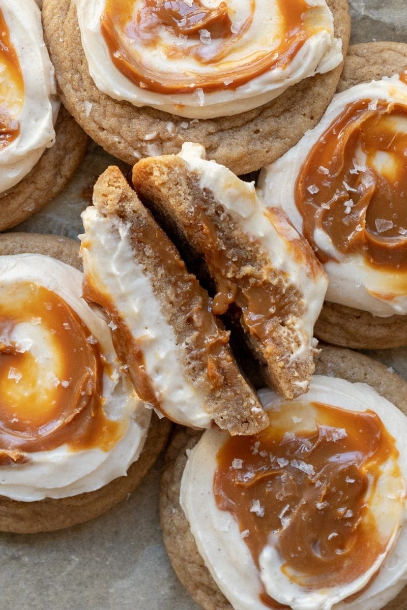 A close up of the cross-section of the dulce de leche cookies, showing the dulce de leche stuffed in them.