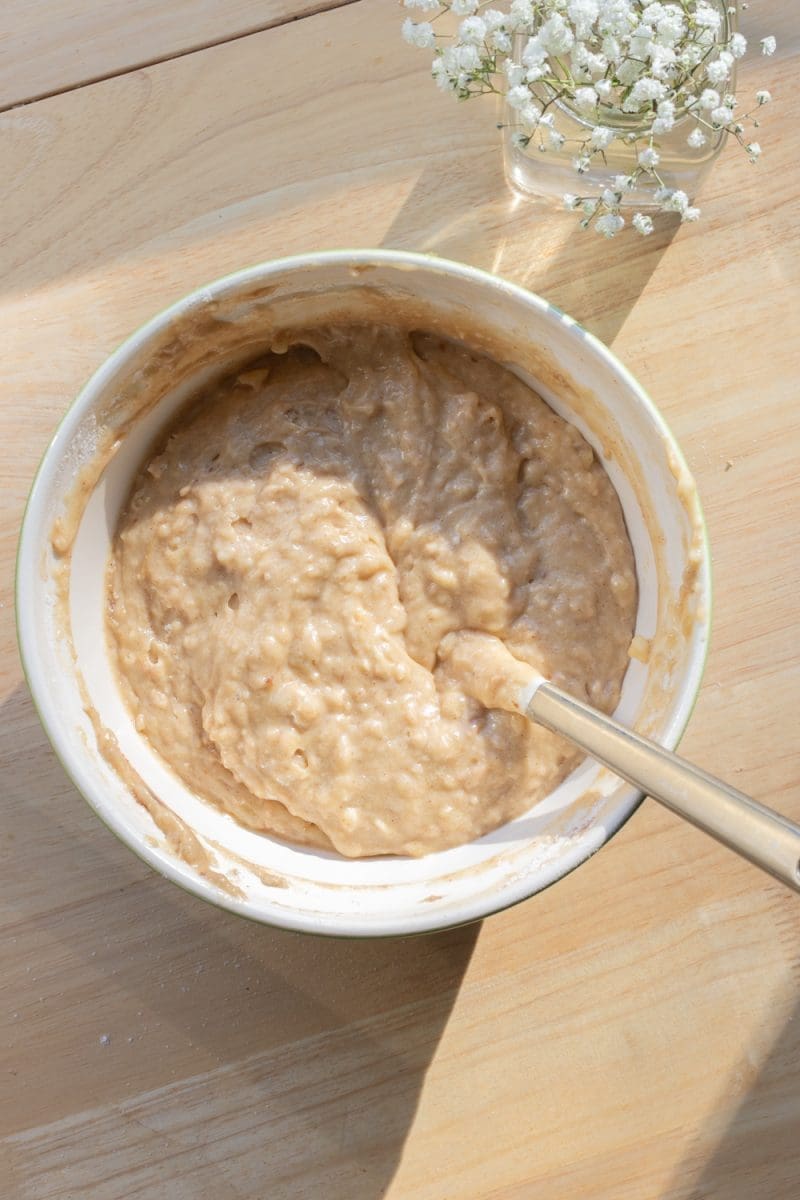 The banana cake batter in a mixing bowl.