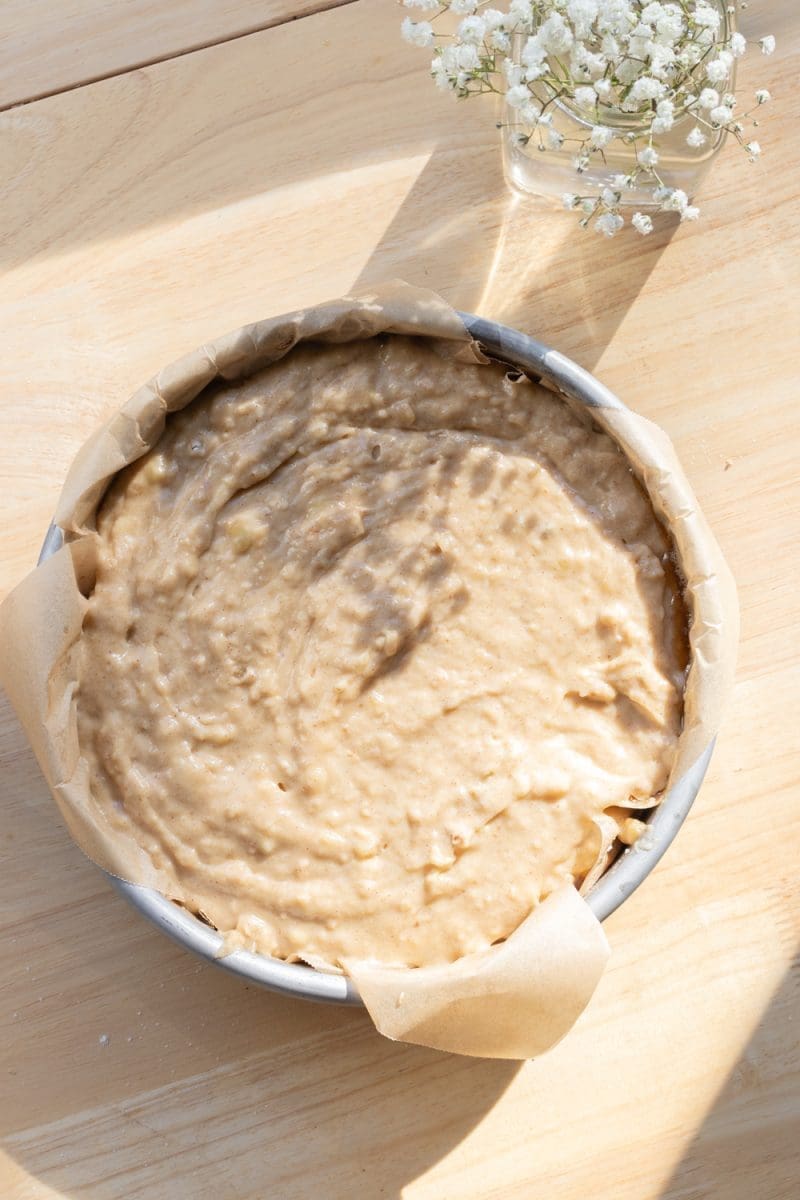 The banana cake in a cake pan, prior to baking.
