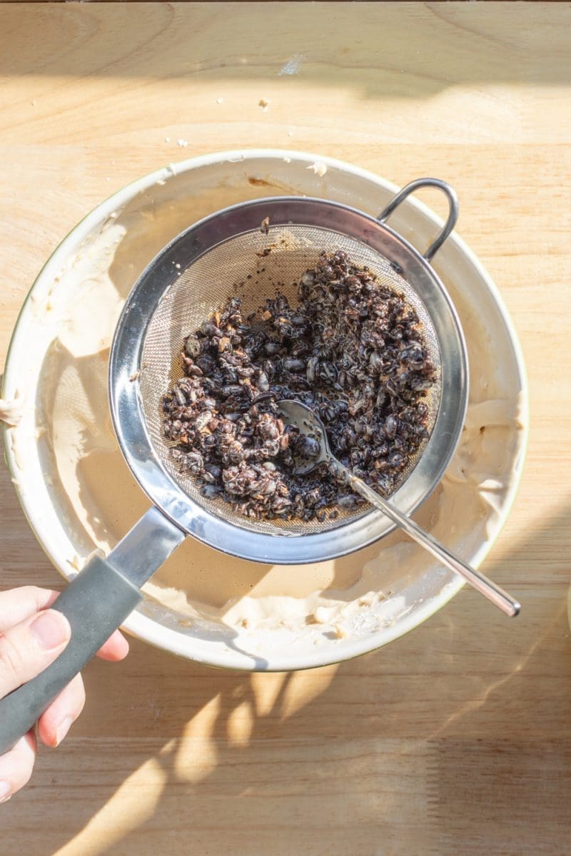 Separating out the espresso beans from the heavy cream.