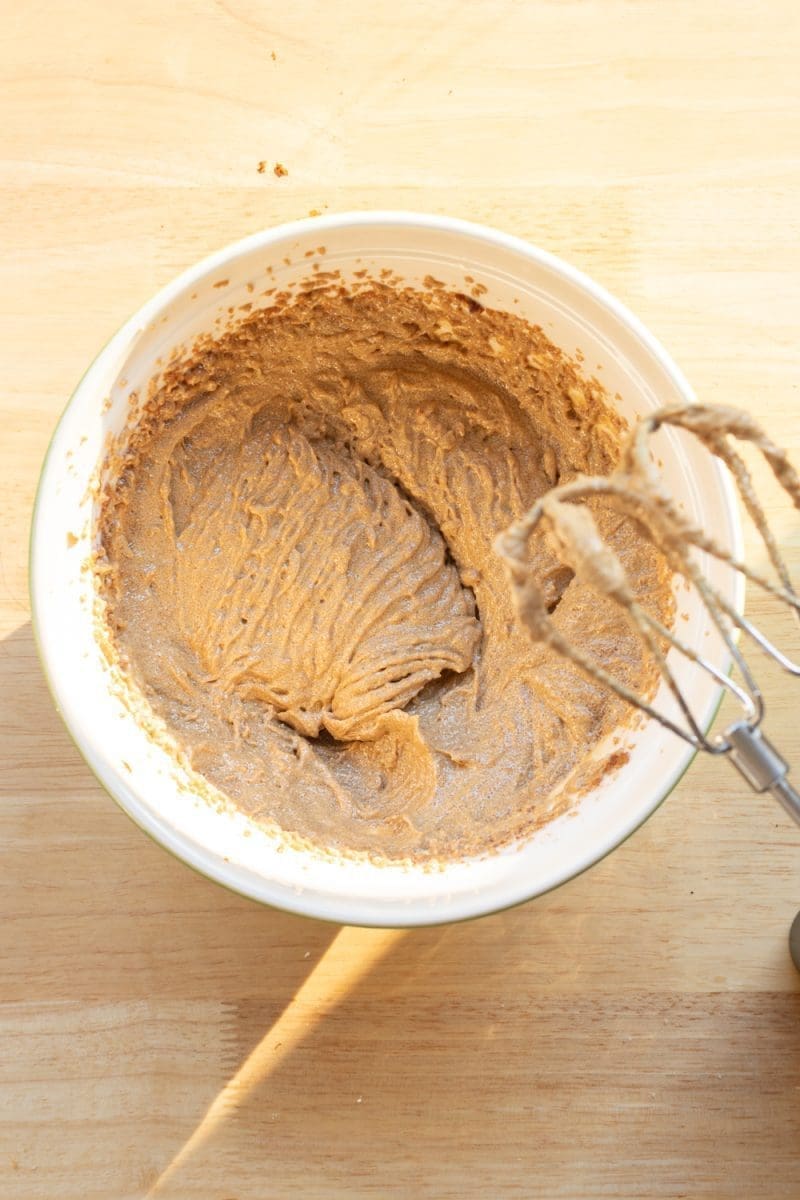 Mixing bowl with the butter, oil, sugar and molasses beaten together.