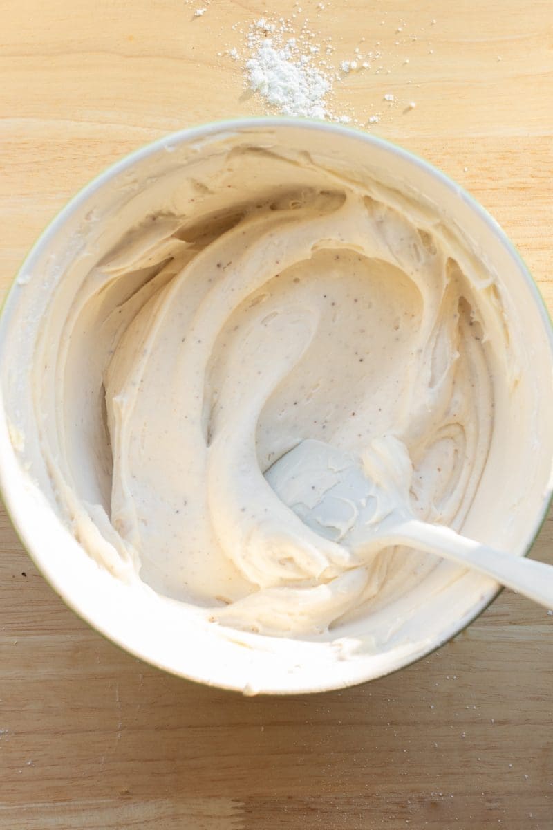 The cream cheese frosting in a mixing bowl.