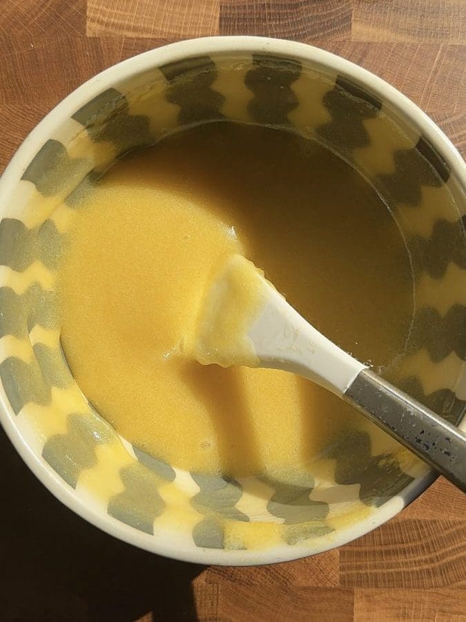 Lemon curd in a mixing bowl.
