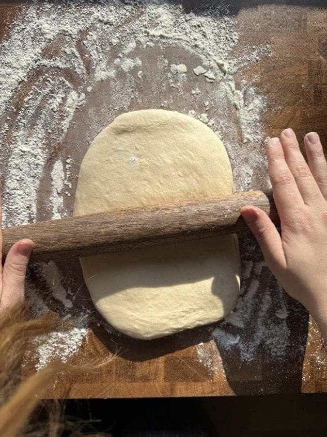 Rolling out the dough.