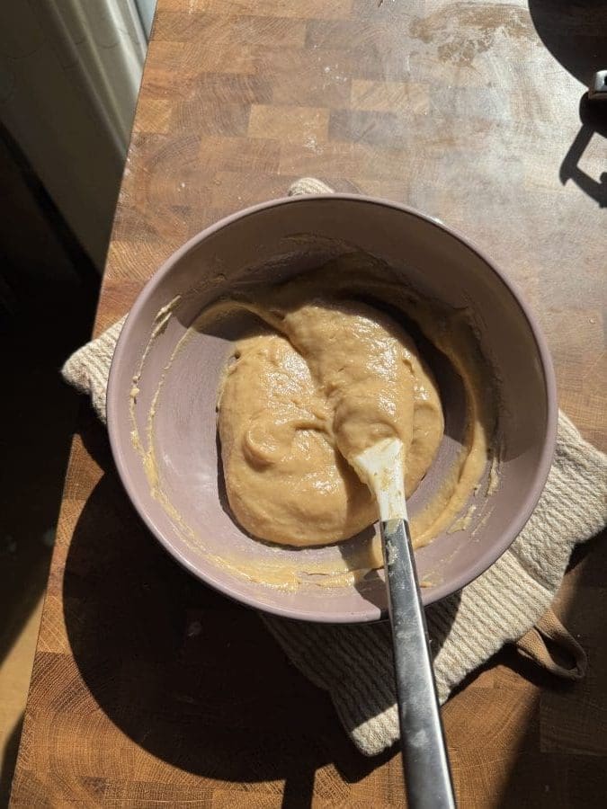 Burnt honey custard in a small mixing bowl.