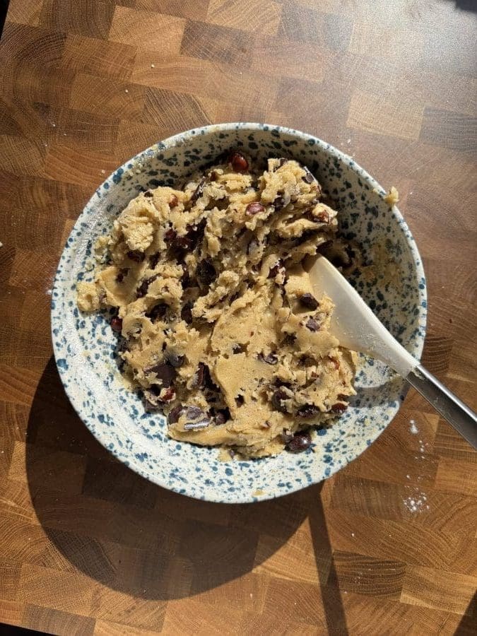 The finished cookie dough in a mixing bowl.