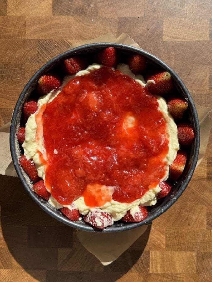 The pudding and strawberry jam layered on the cake.