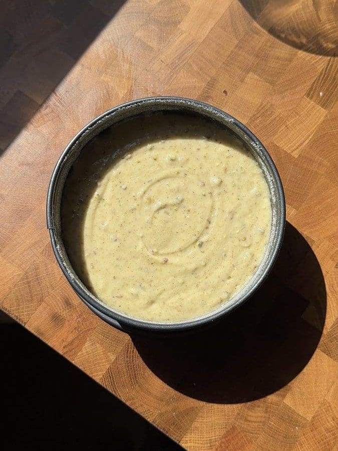 The cake poured into a cake pan.