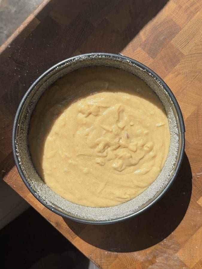 Cake batter in the cake pan.