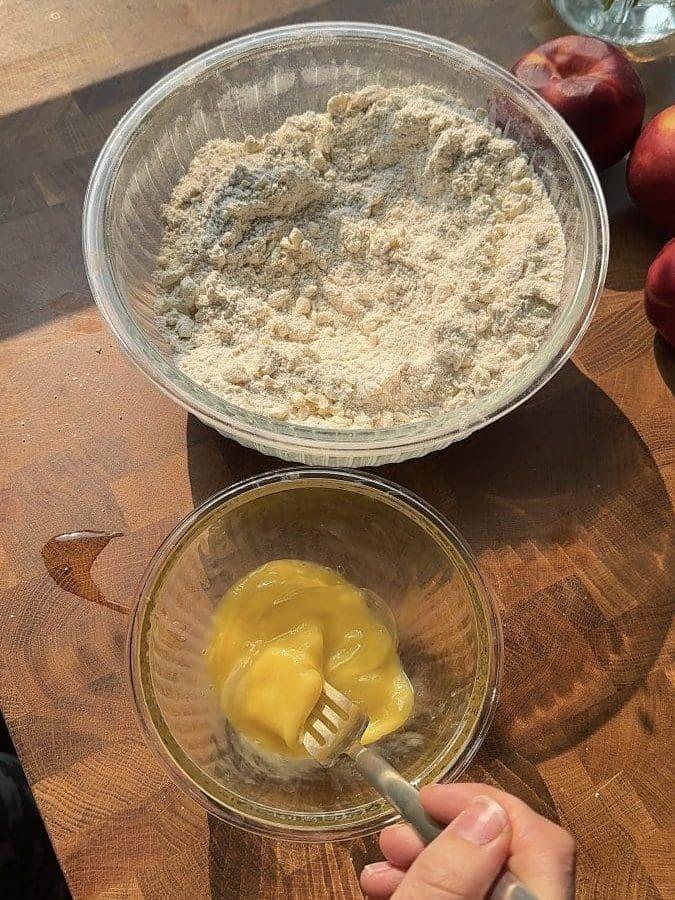 Whisking an egg.