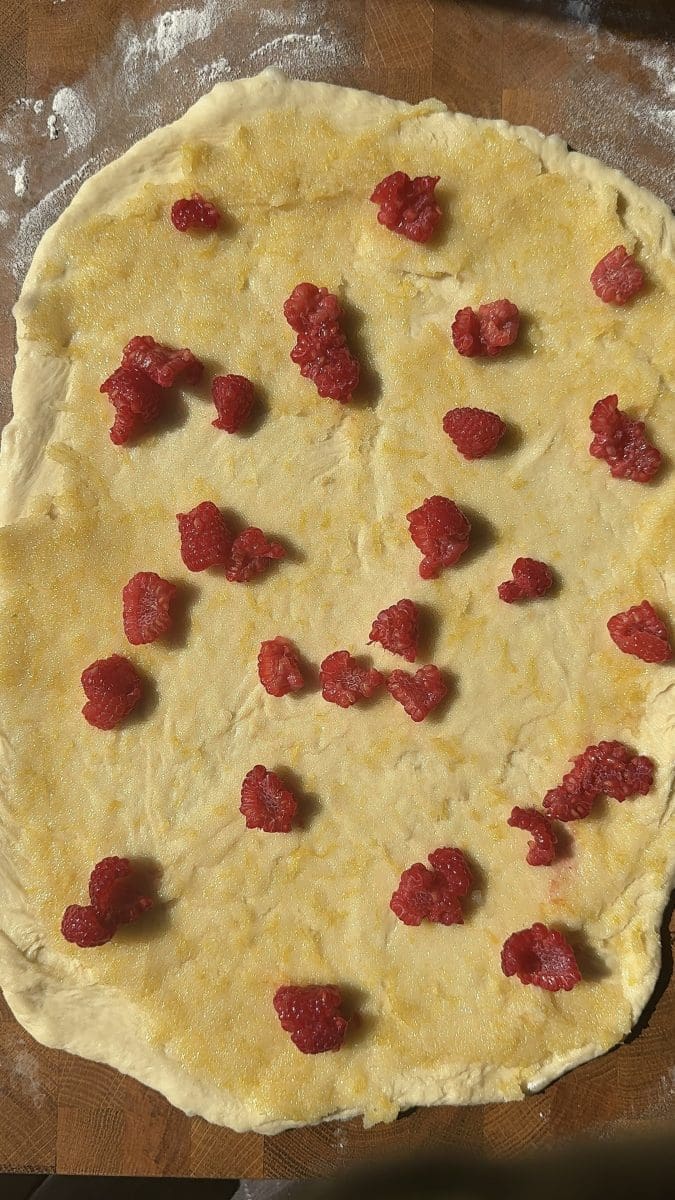 The lemon sugar and raspberries spread over the dough