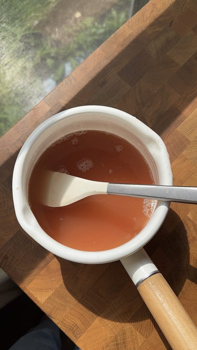 Simple syrup in a saucepan.
