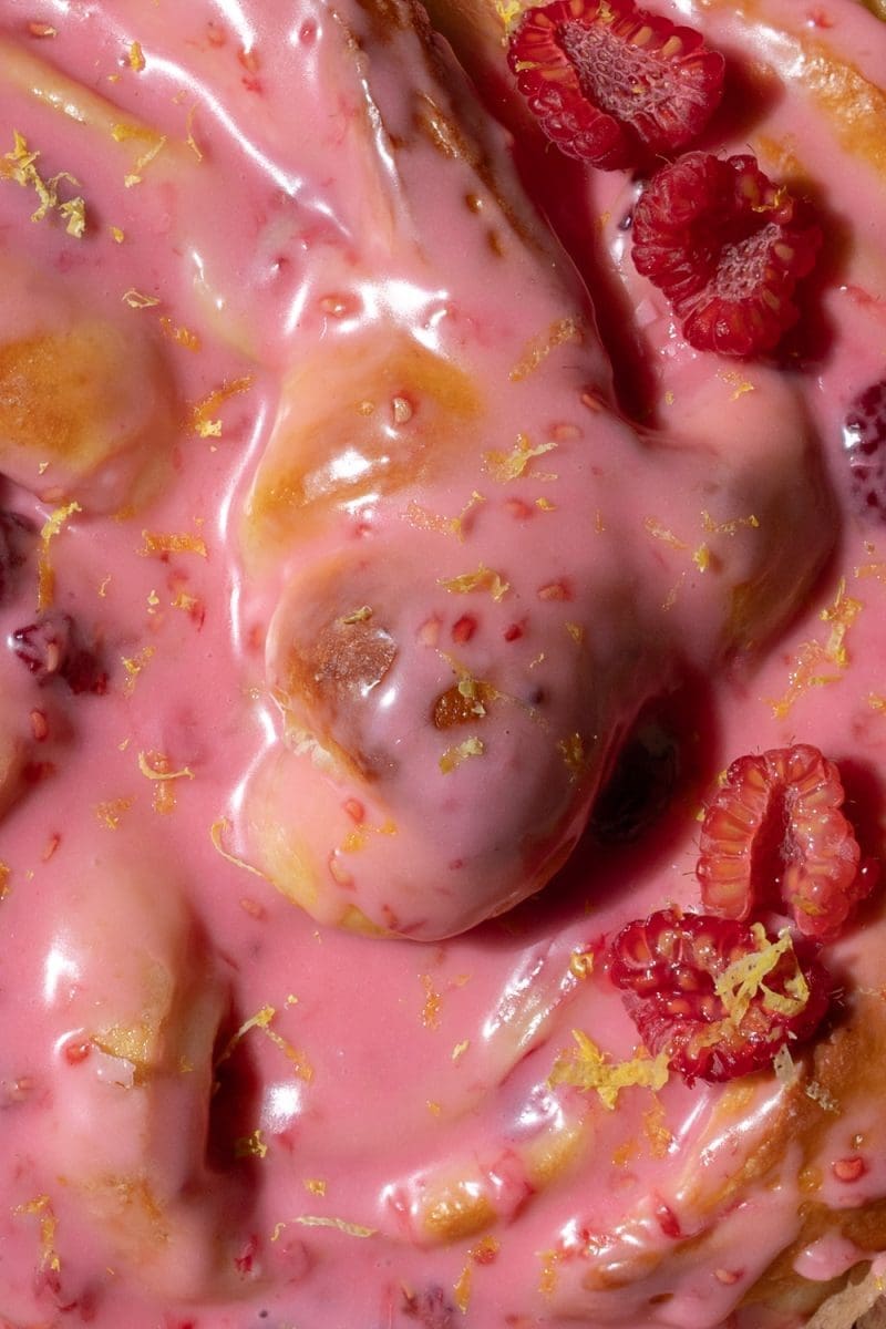 Close up of the frosted giant lemon raspberry brioche bun.