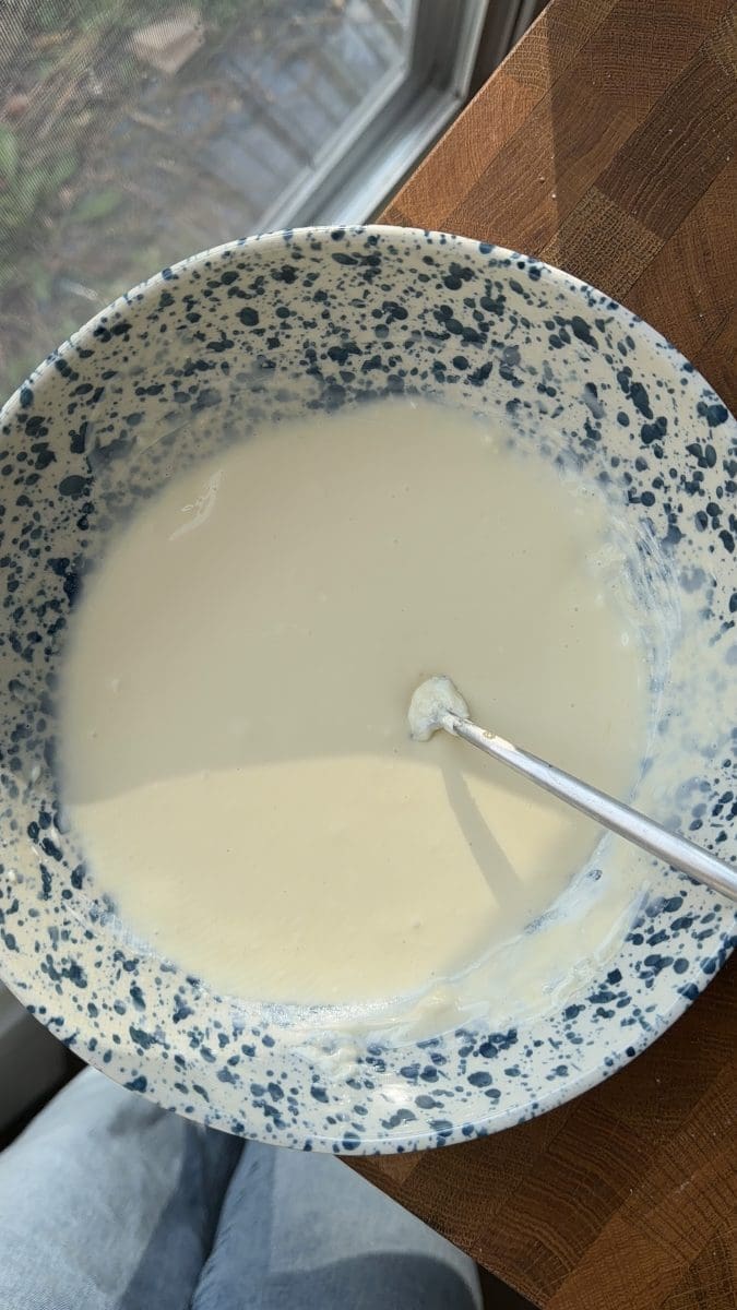 The cheesecake filling in a mixing bowl.