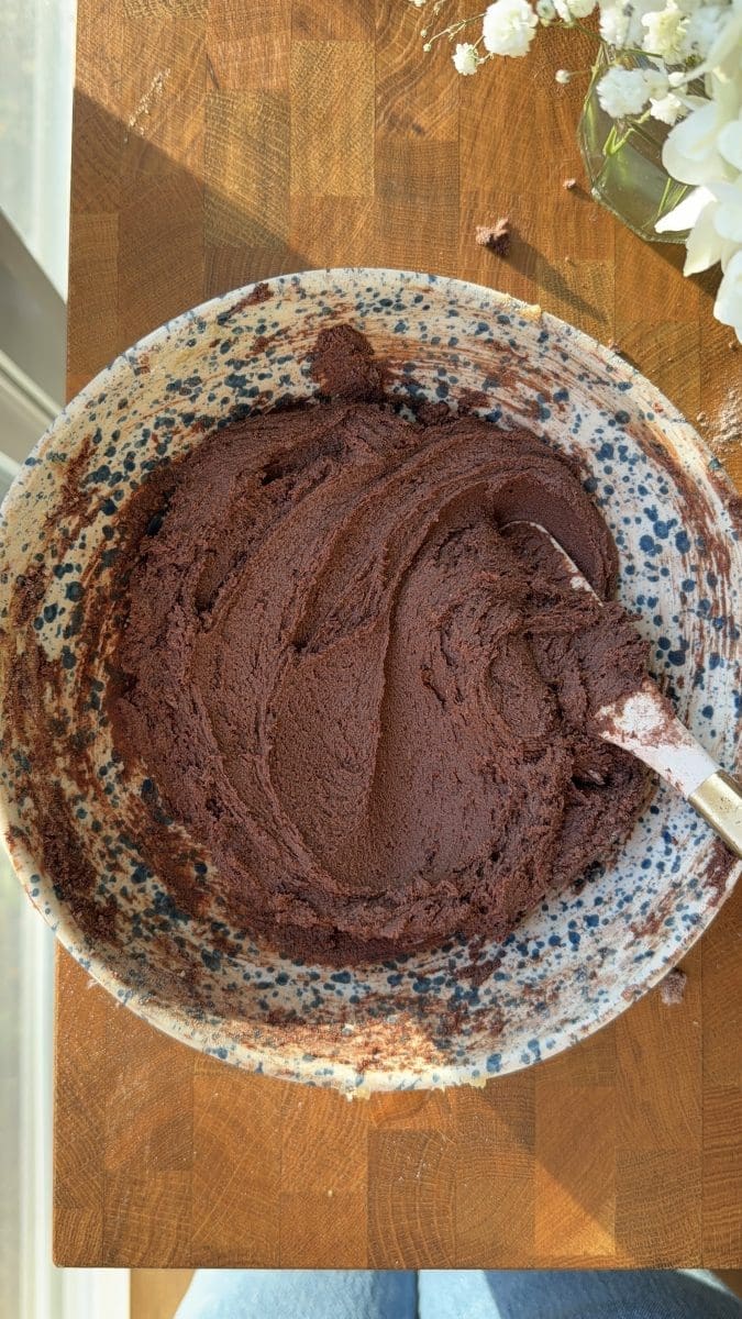 The chocolate sugar cookie dough in a mixing bowl.