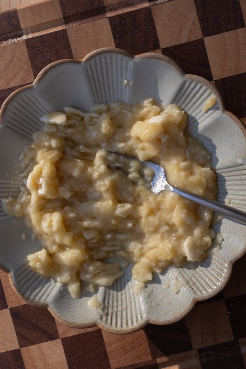 The banana mashed on a plate.