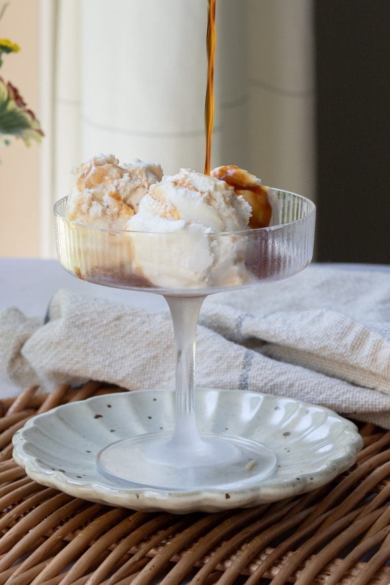 Pouring espresso on to the ice cream.