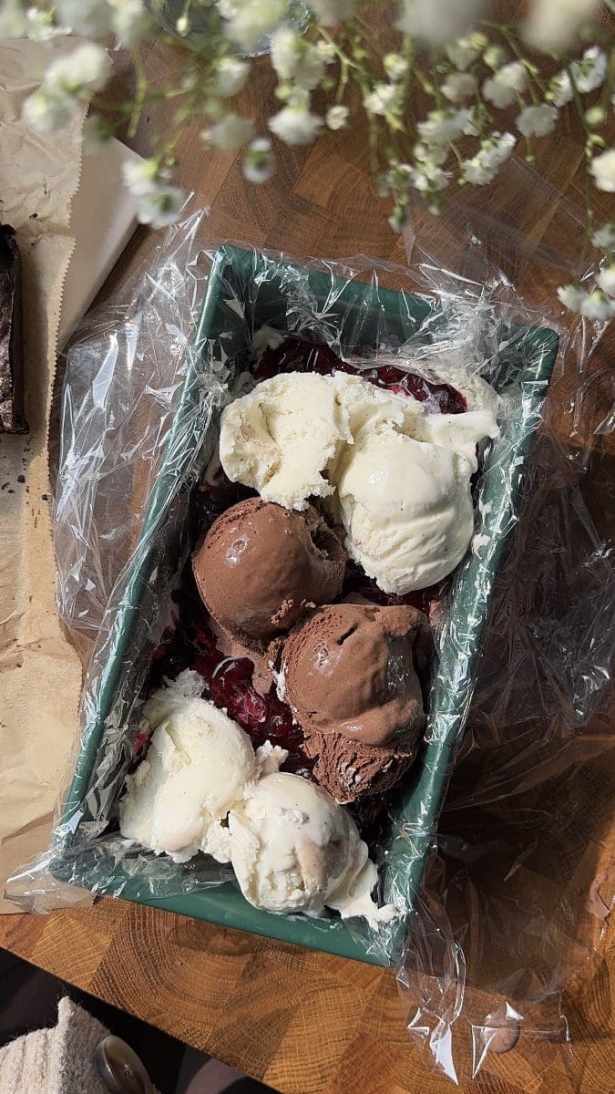 Scoops of vanilla and chocolate ice cream in a loaf pan.