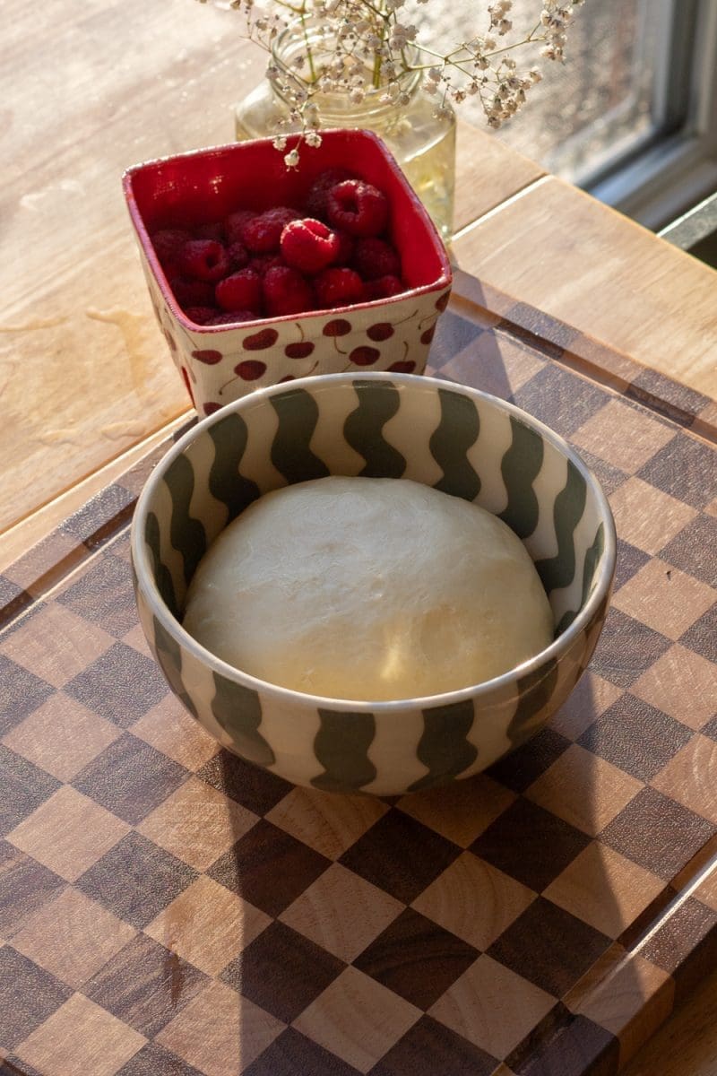 Brioche dough in a small mixing bowl.