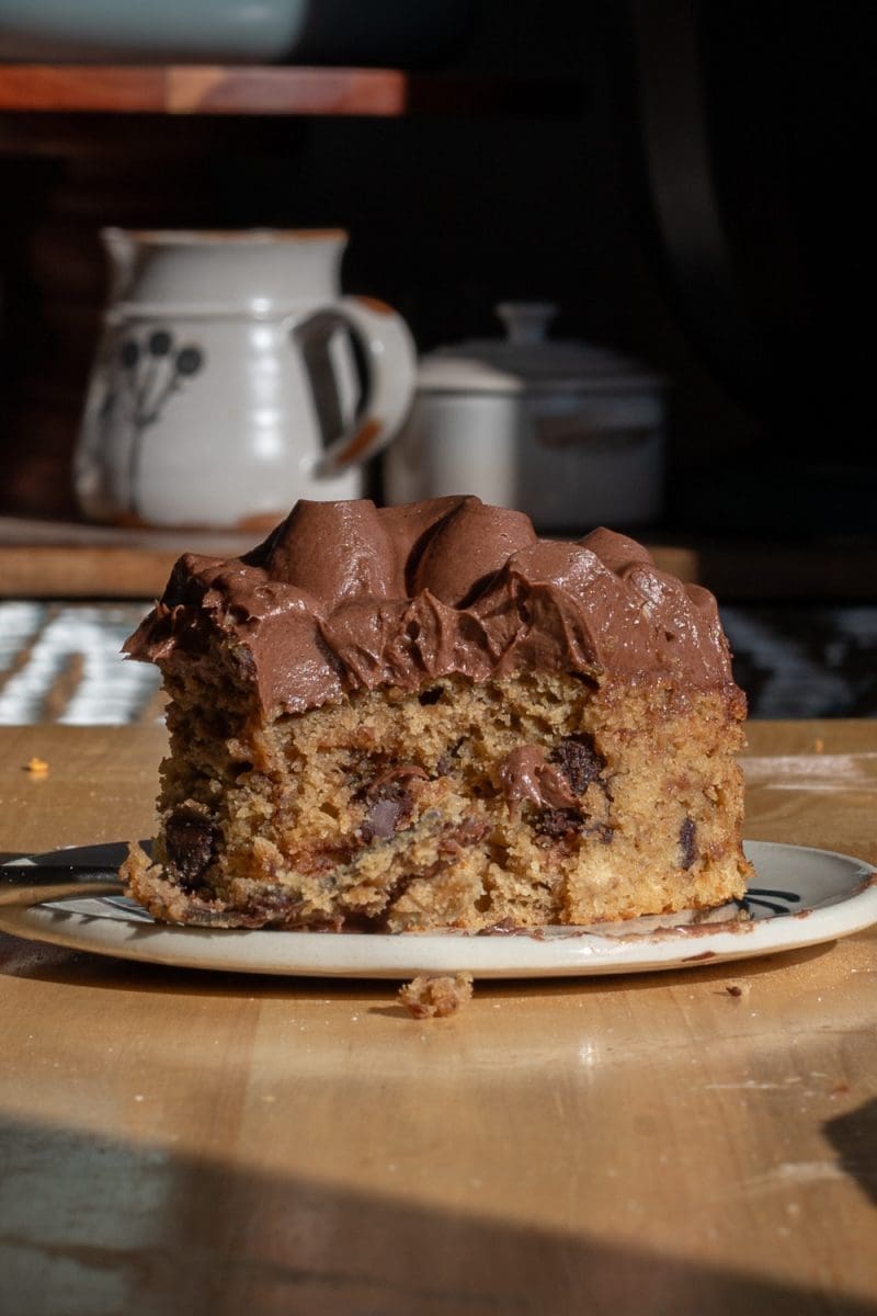 Close up slice of the mocha banana cake that has a bite taken out of it.