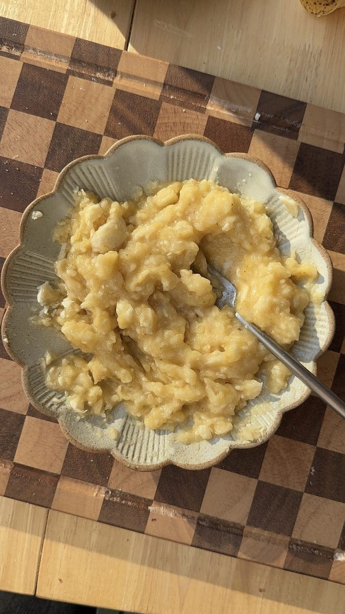 The banana mashed on a plate.