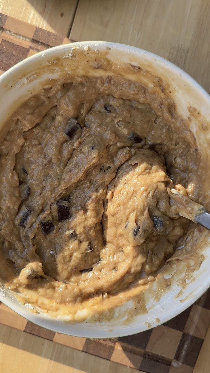 The finished banana cake batter in a mixing bowl.