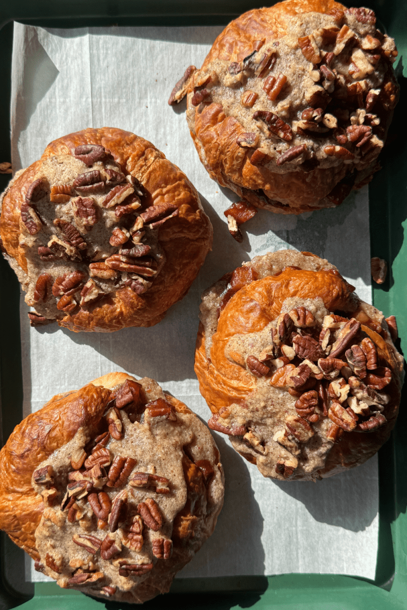 The pecan apple pie croissants on a sheet tray.