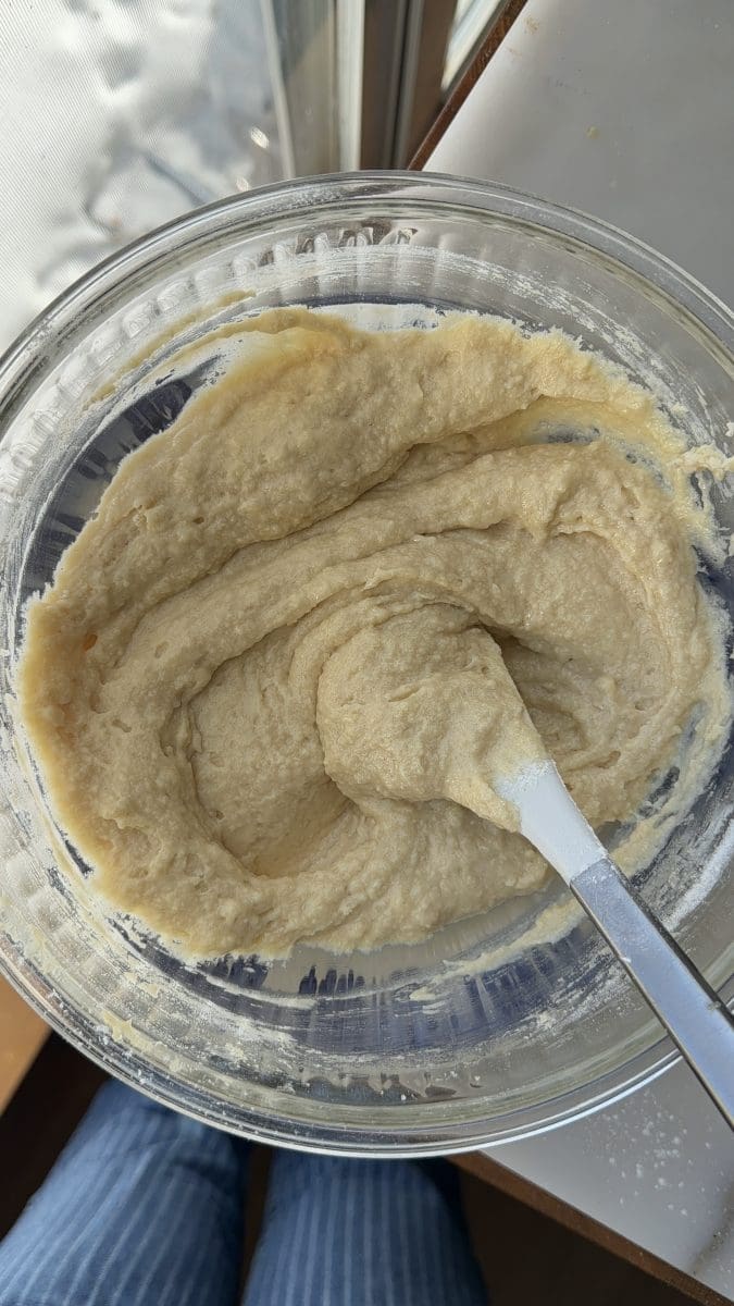The cake batter in a mixing bowl.
